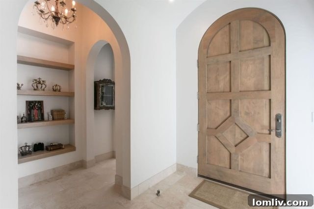 Elegant Moorish arched vestibule leading to the custom white oak front door