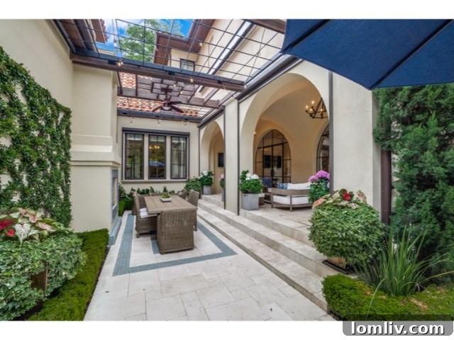 Resort-style swimming pool and spa, surrounded by lush landscaping