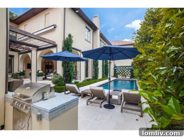 Expansive backyard and pool area, showcasing the luxurious outdoor living space