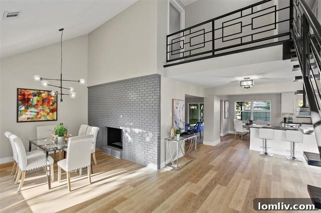 Current interior view of 2606 Beechmont Drive, highlighting the updated open-concept kitchen, modern appliances, and integrated dining area.