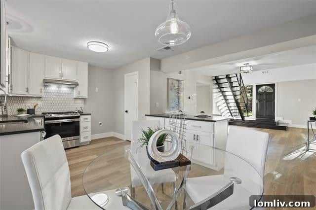 Bright and spacious living area of the mid-century modern home with large windows, a double-sided fireplace, and tasteful furnishings.