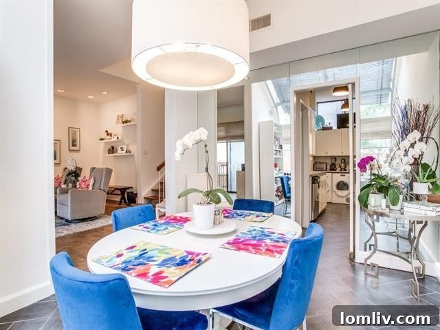 Elevate Your Lifestyle in University Park 7 Bright and Airy Mid-Century Modern Condo Living Area with Vaulted Ceilings