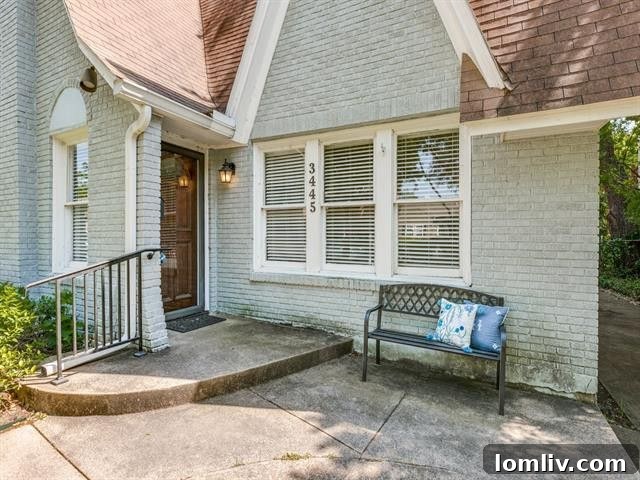 The spacious living room of 3445 Purdue, featuring wood-look tile floors and ample natural light.