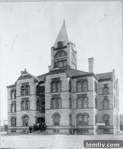 An early monochrome photograph of the Erath County Courthouse, featuring its intricate architecture