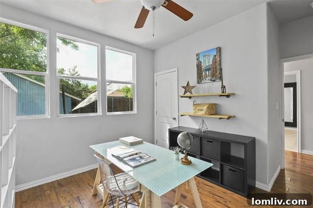 Modern custom kitchen with granite countertops, gas cooktop, breakfast bar, and a unique chalkboard wall with exposed brick