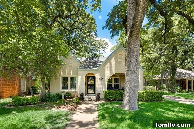 Oakhurst Fort Worth street scene with historic architecture and lush trees