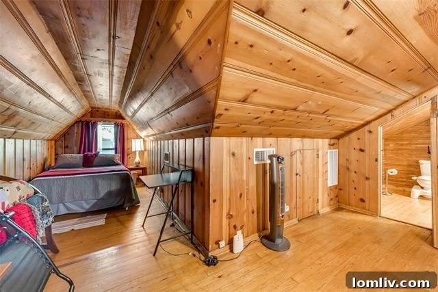 Upstairs attic room with knotty pine walls