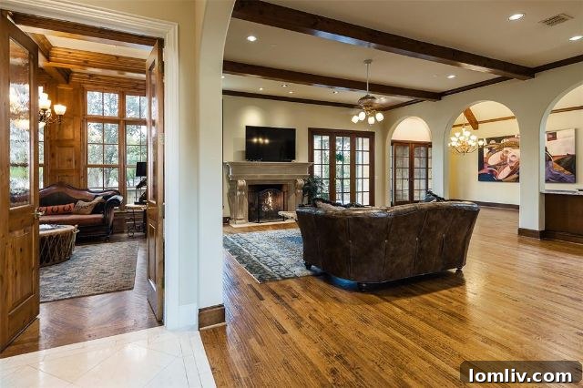 Bright and spacious living room with large windows at 7009 Lake Edge Drive