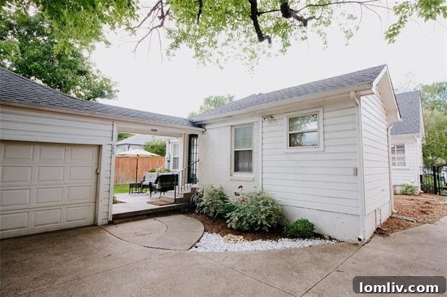 The American Dream Thrives in Dallas 14 Outdoor patio and fenced lawn of charming Dallas cottage
