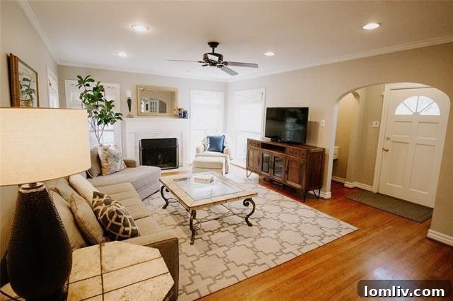 The American Dream Thrives in Dallas 10 Inviting living room with fireplace and hardwood floors in Dallas cottage
