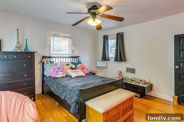 Detailed view of aquamarine cabinetry and Hispano-Moresque tiles in primary bathroom