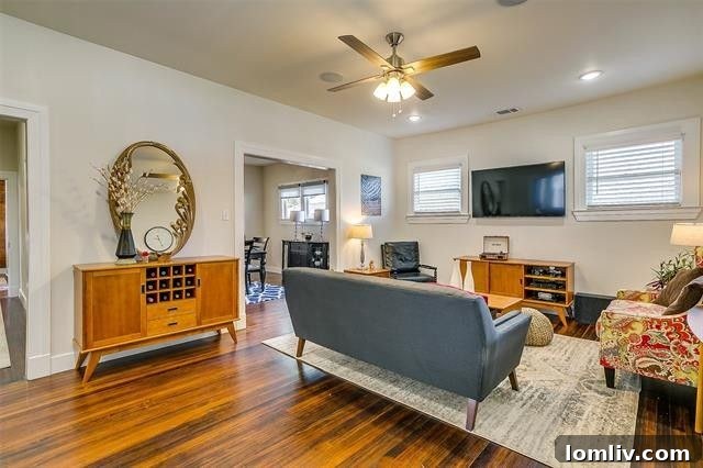 Renovated living room of Fairmount home with refurbished pine floors and French doors