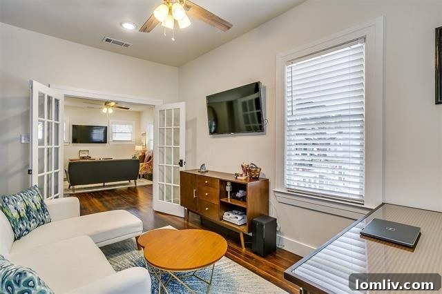 Open concept living and dining area in a newly renovated Fairmount home