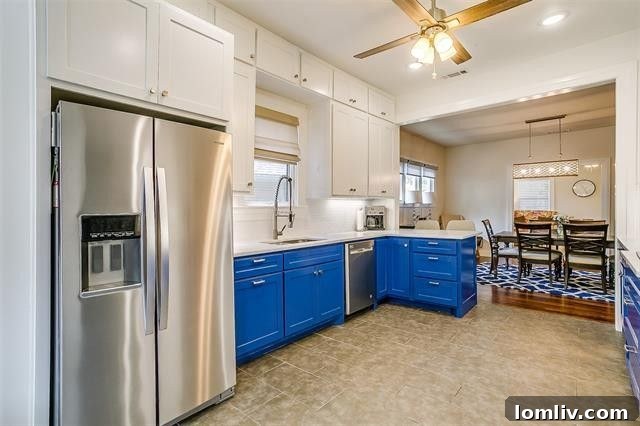 Close-up of kitchen featuring white quartz countertops and stylish backsplash