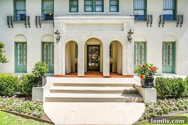Front facade of the vintage Berkley Place mini-villa with stucco walls and red tile roof