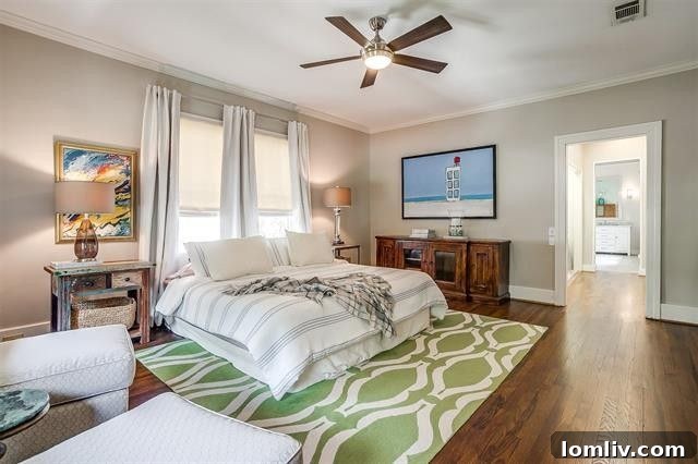 Spacious principal bedroom suite with dressing area and built-in cabinets