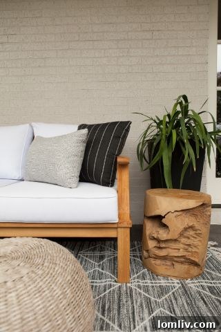 ML Interiors: Crafting Your Outdoor Oasis 4 Stylish outdoor rug defining a seating area in a Southcrest backyard