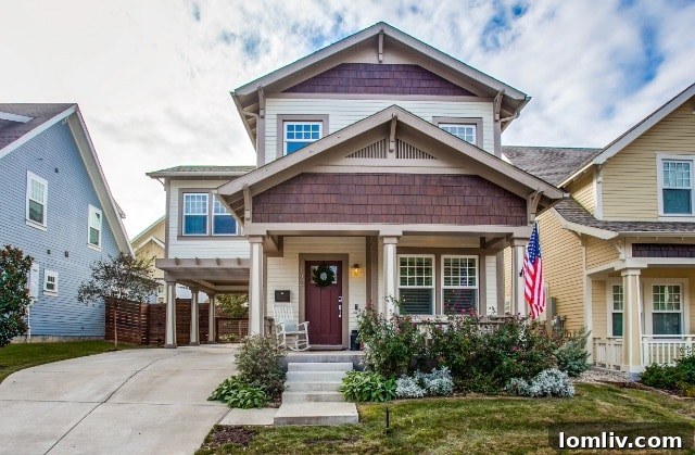 A luxurious home exterior, showcasing modern architecture and a well-maintained lawn.