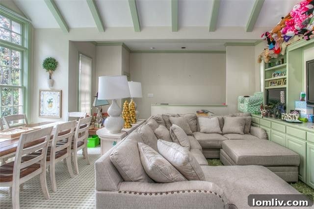 Principal bedroom with views overlooking the private pool and lush garden