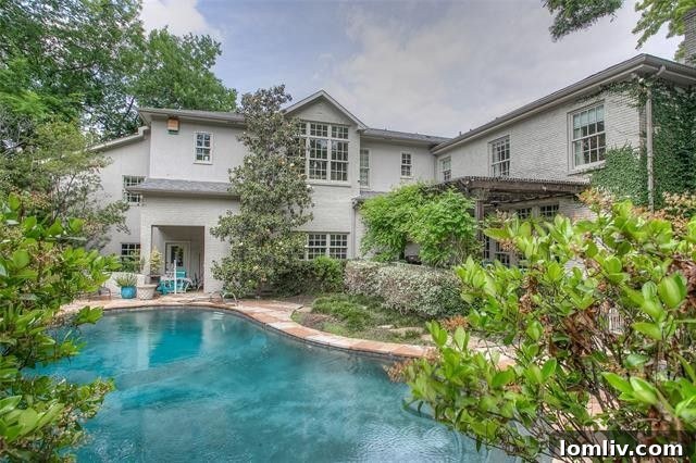 Elegant bathroom with tiled shower and stylish vanity on the second floor