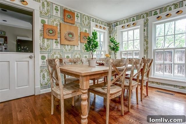 Modern eat-in kitchen featuring Carrara marble countertops and robin's egg blue backsplash