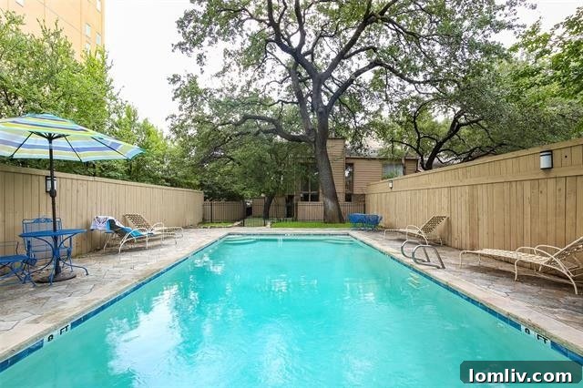 A serene view of the community amenities, including a refreshing pool, available to residents.