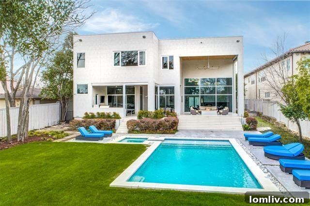 Stunning modern home exterior at dusk with illuminated pool