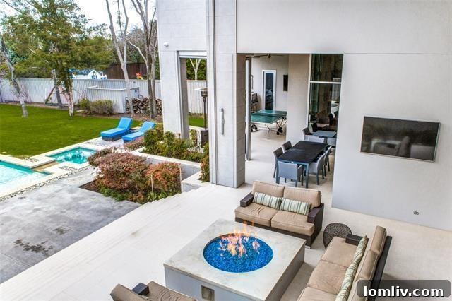 Sleek, modern kitchen with integrated appliances and island seating