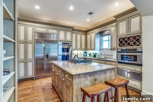 Comfortable family room with custom built-ins and access to the outdoor patio