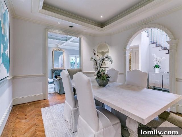 Luxurious Dining Area with Chandelier in Christopher Place Townhome