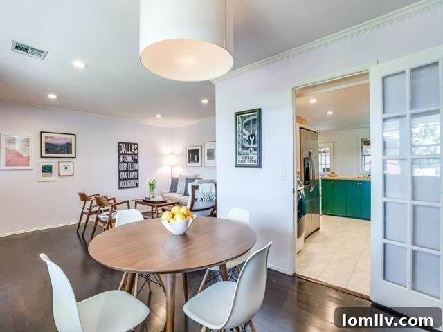 Inviting living space inside the East Dallas bungalow, showcasing abundant natural light.