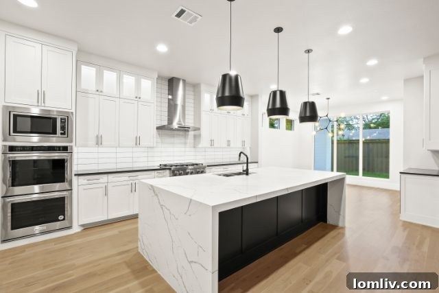 Elegant dining room with contemporary lighting in a luxury Chris Sandlin home