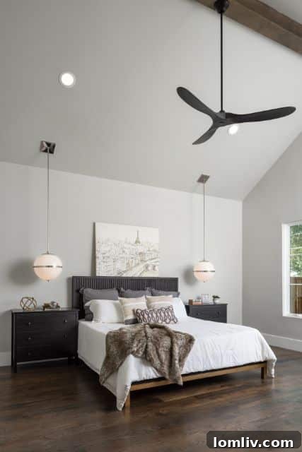 Grand entryway with a modern staircase in a luxurious Chris Sandlin property