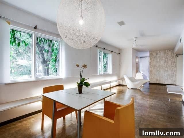 Leading Lighting Designer Tully Weiss' Lakewood Home Hits the Market 5 Modern kitchen with sleek cabinetry and open shelving in Lakewood residence