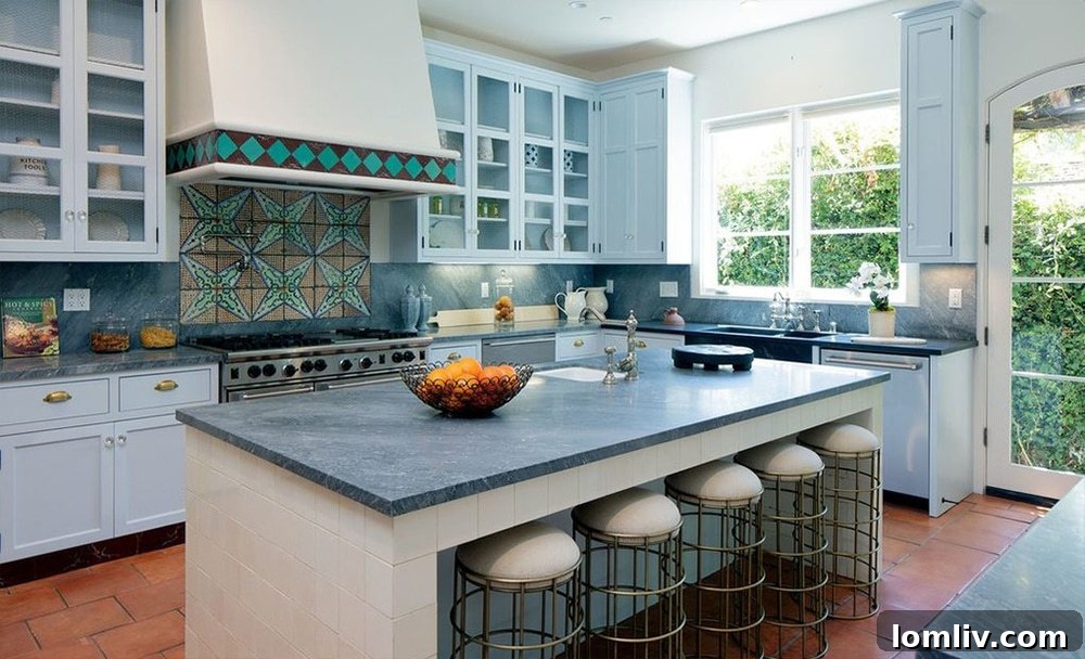 Luxurious chef's kitchen with island in Geena Davis's Mediterranean home