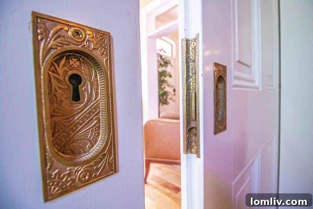 Historic pocket doors with original hardware, blending functionality and elegance