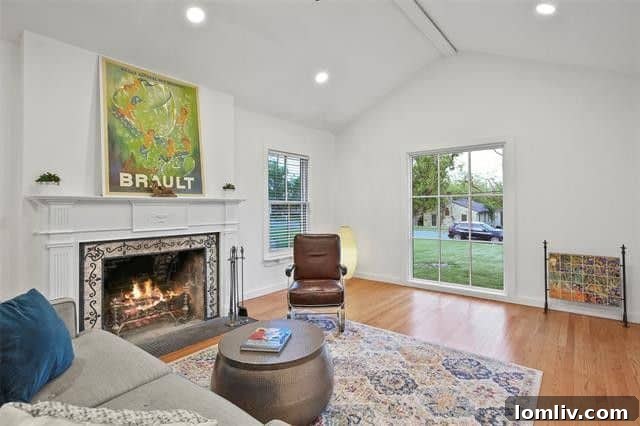Bright and airy living room with a wood-burning fireplace in East Kessler