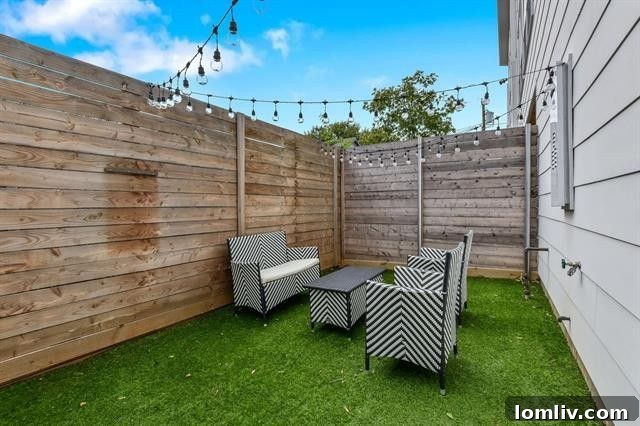 Private backyard with astro-turf and cafe lights, ideal for urban relaxation