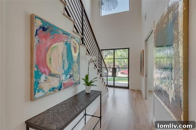 Spacious living room with high ceilings and wide plank white oak floors