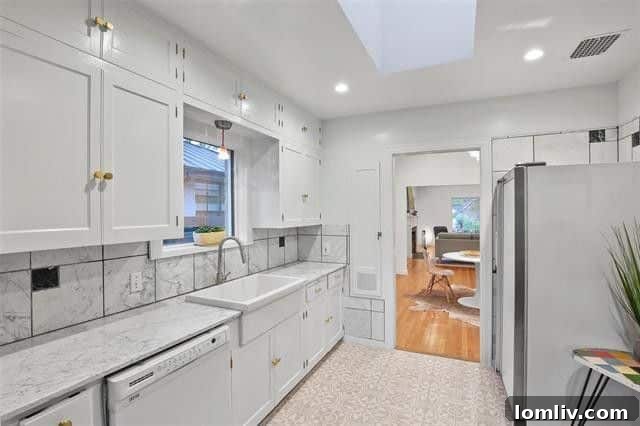 Bright and airy eat-in kitchen with a skylight and modern hardware