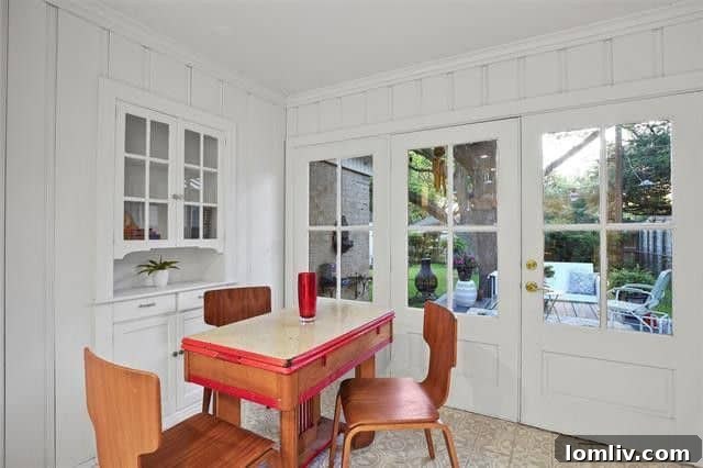 Spacious sunroom converted into a home office with upgraded Pella windows