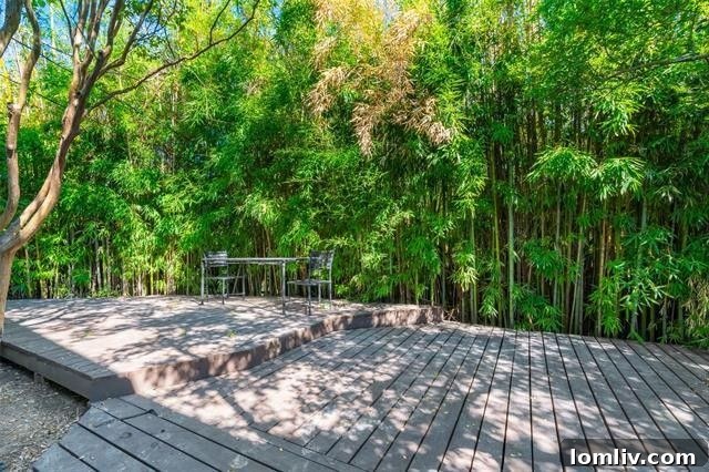 Expansive wood deck shaded by mature trees, ideal for outdoor entertaining
