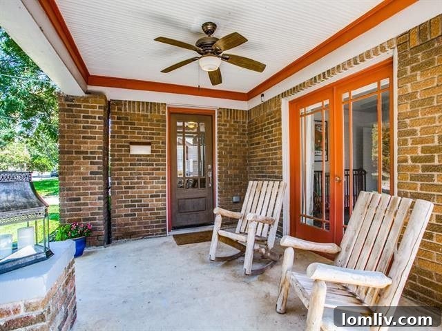 Classic Tudor facade with a welcoming front porch and established trees