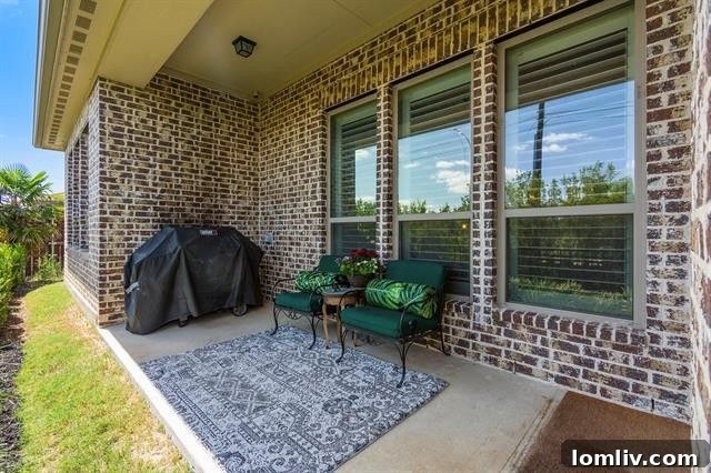 Serene back porch and lush landscaping at 939 Highpoint Way.