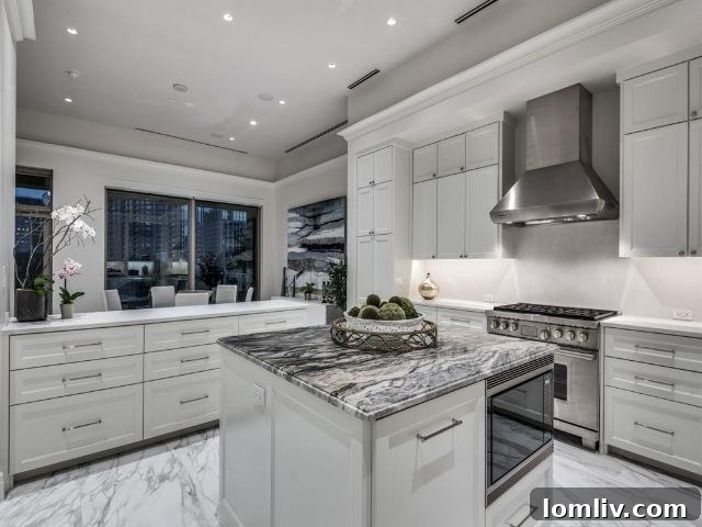 The Stoneleigh Residences: The Zenith of Sky-High Opulence 9 Gourmet kitchen with Frosty Carrina Caesarstone countertops in Stoneleigh