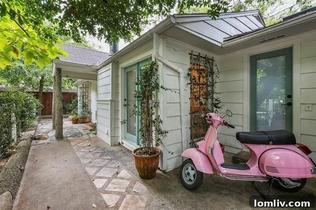 Charming Lakewood Cottage Exterior with Green Lawn and Mature Trees