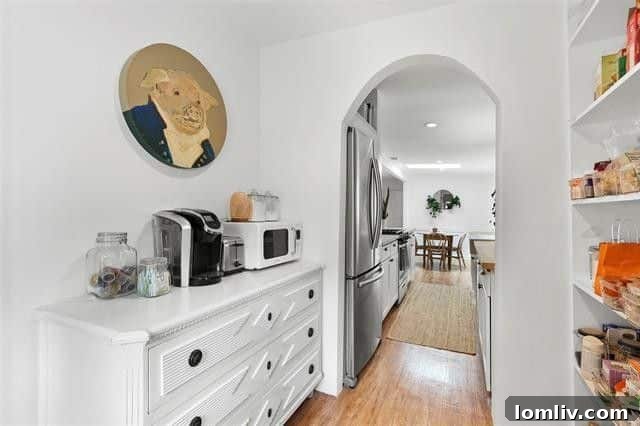 Modern galley kitchen featuring stainless steel appliances and stylish finishes