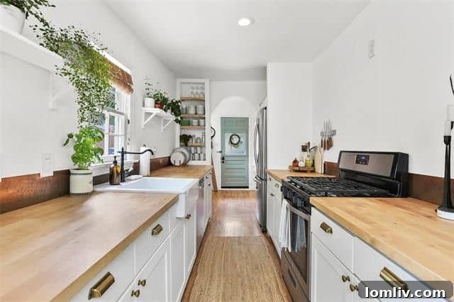 Close-up of the stylish galley kitchen with a farm sink, butcher block counters, and indoor garden shelf