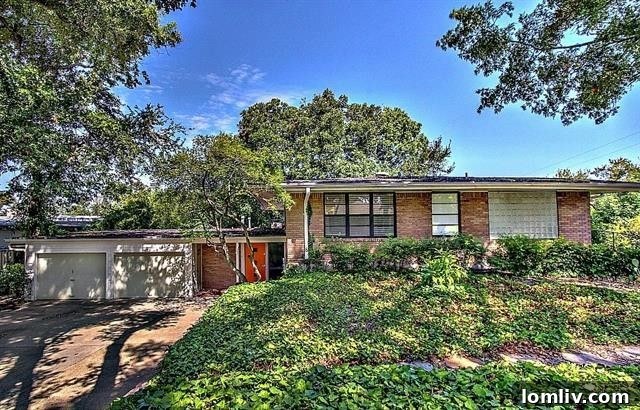 Historic East Dallas home at 9755 Van Dyke Road backing to Norbuck Park, built by Trammell Crow family