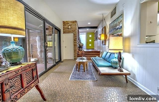 Living area with abundant windows overlooking the treed half-acre lot at 9755 Van Dyke Road